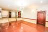 Tiled spare room featuring recessed lighting, wainscoting, a chandelier, tile walls, and elevator