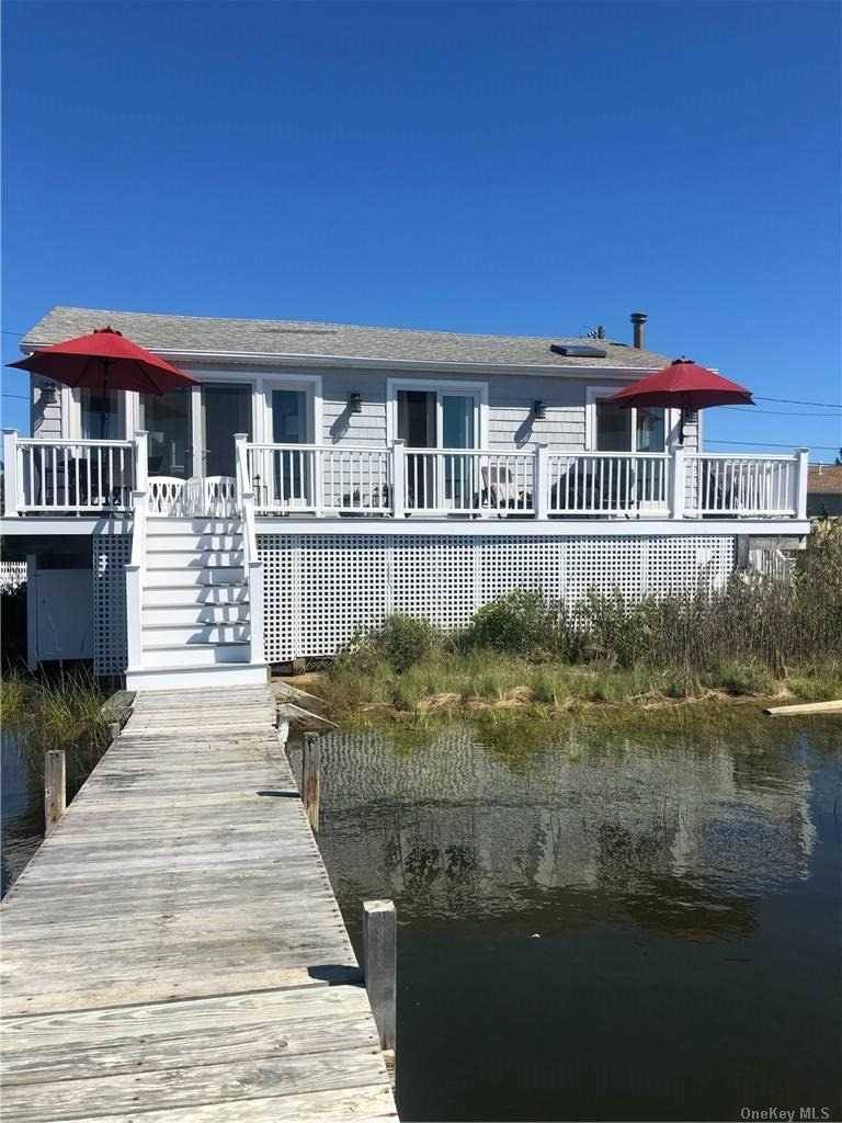 Spend your summer on Pond Point in Westhampton Beach, overlooking Moriches Bay.