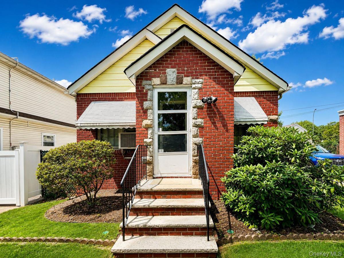 Brick-clad exterior with yellow siding accents