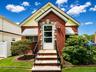Brick-clad exterior with yellow siding accents