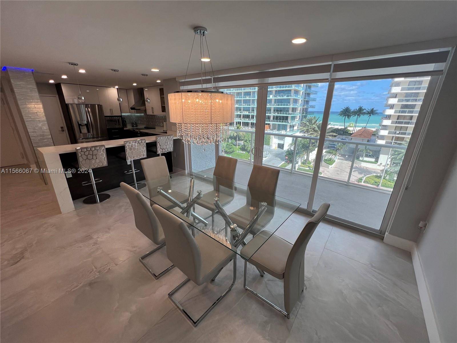 Beautifully remodeled spacious corner unit with partial ocean view located on Millionaire s Row.