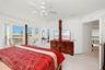 Master bedroom with double door and access to balcony