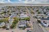 Aerial overview of property's location featuring nearby suburban area