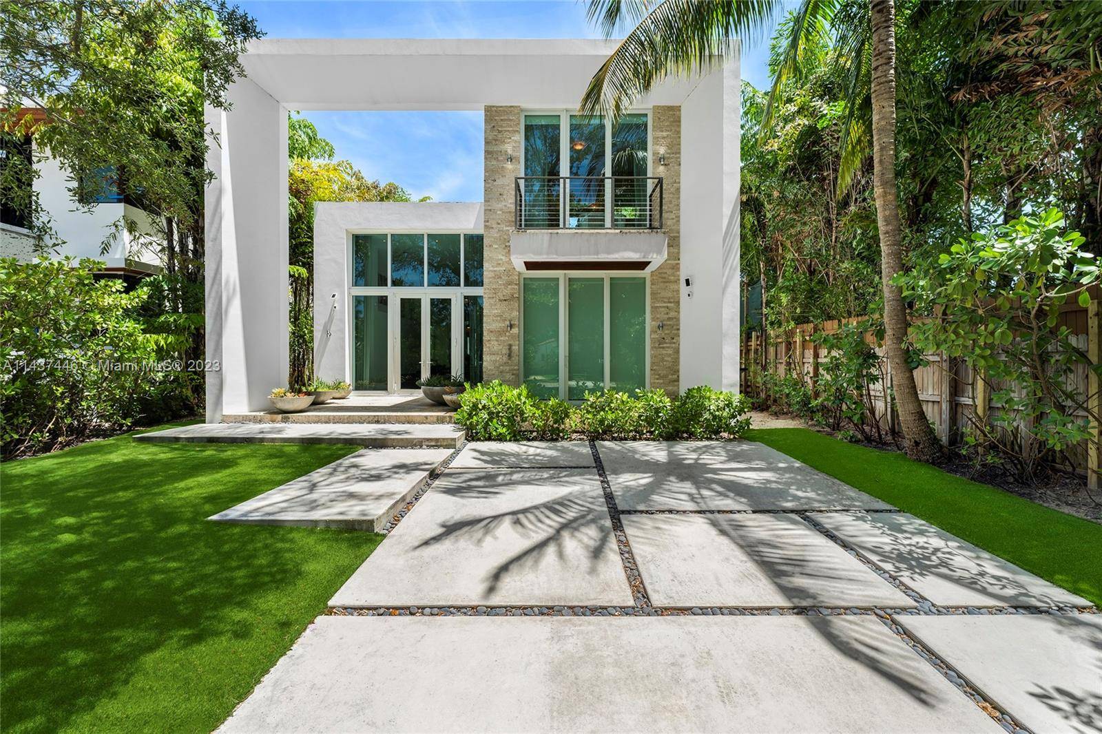 The contemporary 2 story home boasts a sleek design and is situated on a lushly landscaped 7, 500 SF lot.