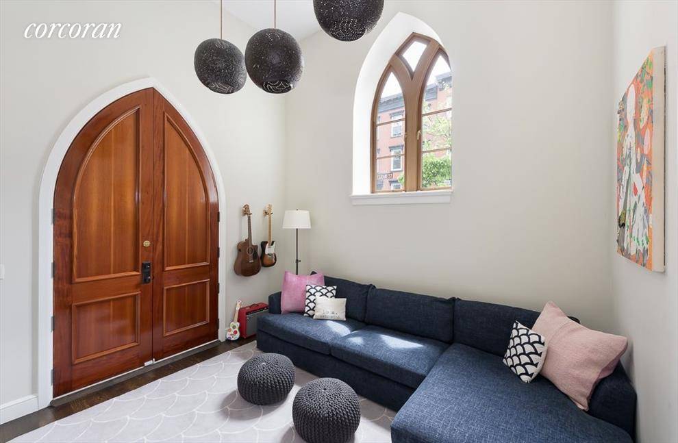 Stunning 2 bedroom, 2. 5 bathroom plus large media room guest room duplex condo on coveted Strong Place in prime Cobble Hill.