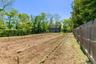 planting fields behind barn