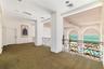 Primary Bedroom with ensuite and walk-in closets behind closed door, walk out terraces overlooking ocean. There is great wall space throughout the hom