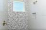 Bedroom #3 en suite bathroom with walk in tile shower