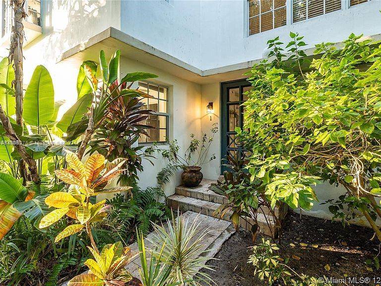 Stunning turnkey second level Multi Family Fourplex Oasis with tropical garden landscaping just minutes from South Beach, Lincoln Rd, Faena District and The Edition Hotel.
