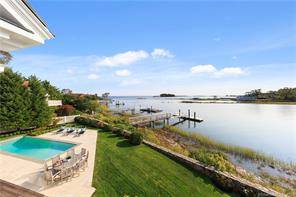 BEYOND WATERVIEWS ! This timeless direct waterfront home was designed by J.