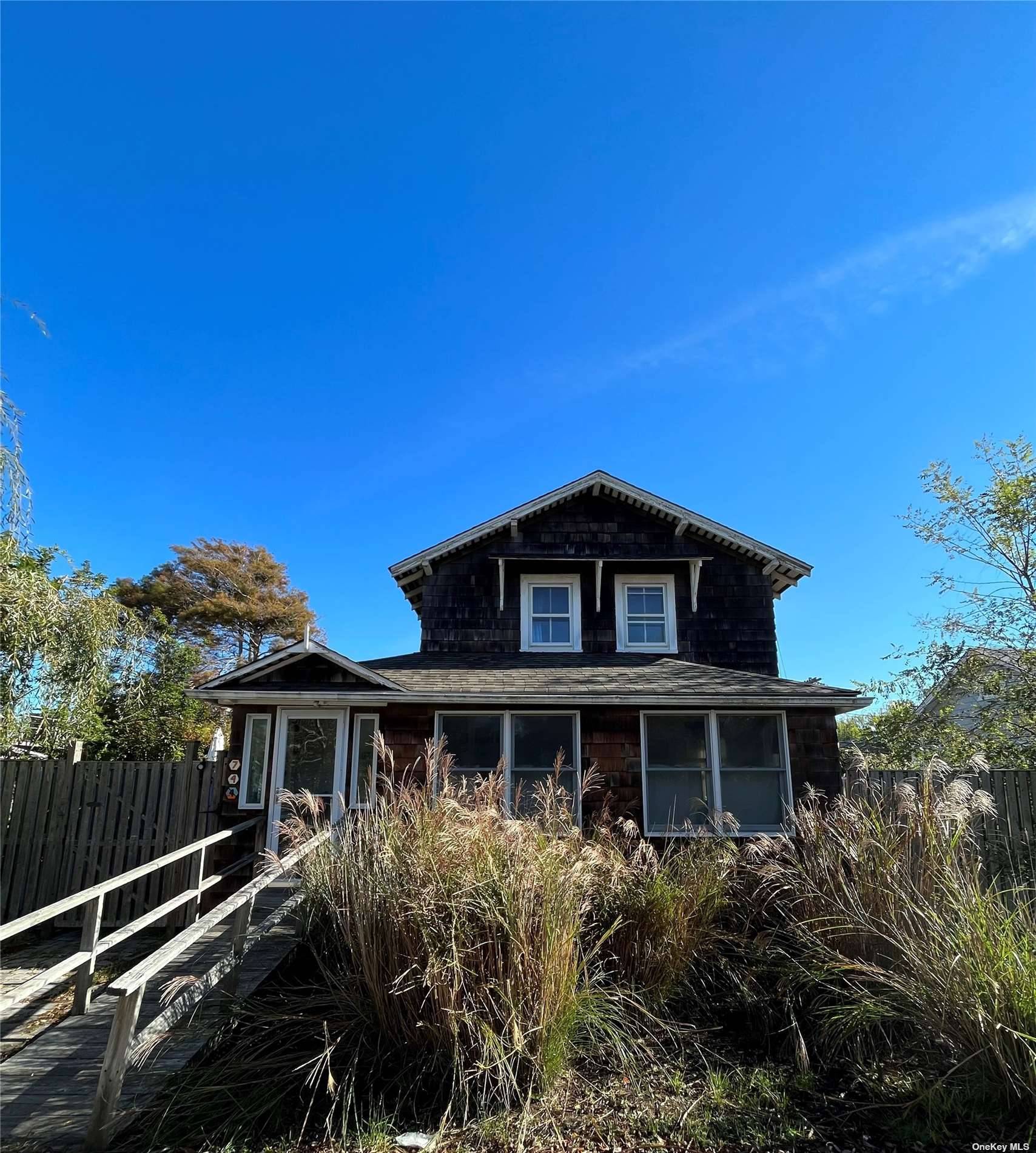 This Classic Fire Island Home In A Great Location Has Spacious 3 Bedrooms With 1.