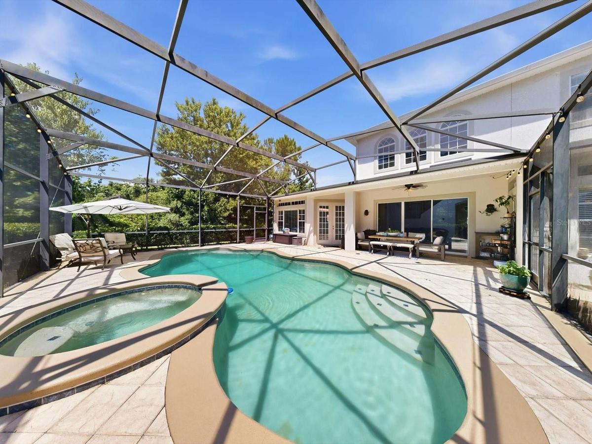561 Harriswood Court heated pool with spa. Covered lanai with conservation view.