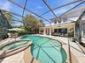 561 Harriswood Court heated pool with spa. Covered lanai with conservation view.