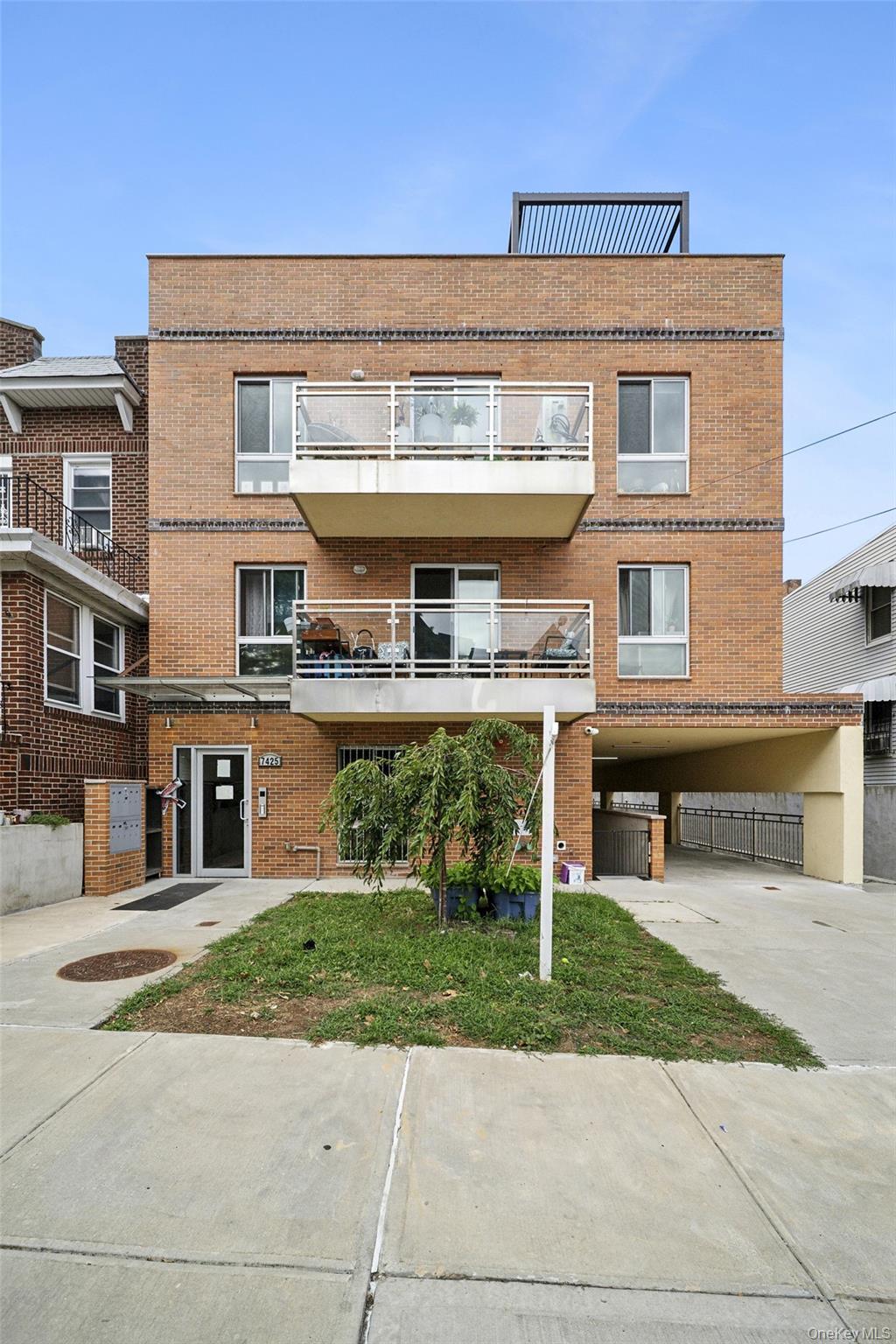 View of building exterior with driveway