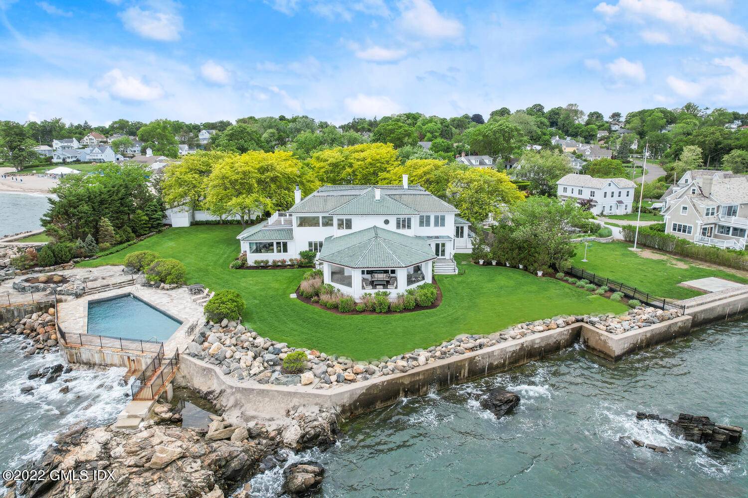 Stunning gated Waterfront Estate with 240 feet of ocean frontage awaits you !