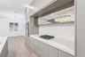 Kitchen is complete with a built-in gas cooktop.