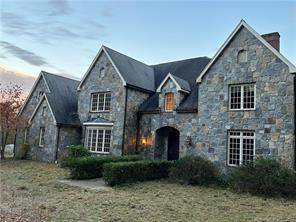 Custom colonial designed by architect Moisan located at the end of a cul de sac on a 57 acre lot.