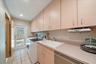 LAUNDRY with great built-in Sub Zero dual fridge, FULL bath, ACCESS to the outside!