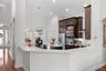 Kitchen pass-through with open sightlines to the living spaces.