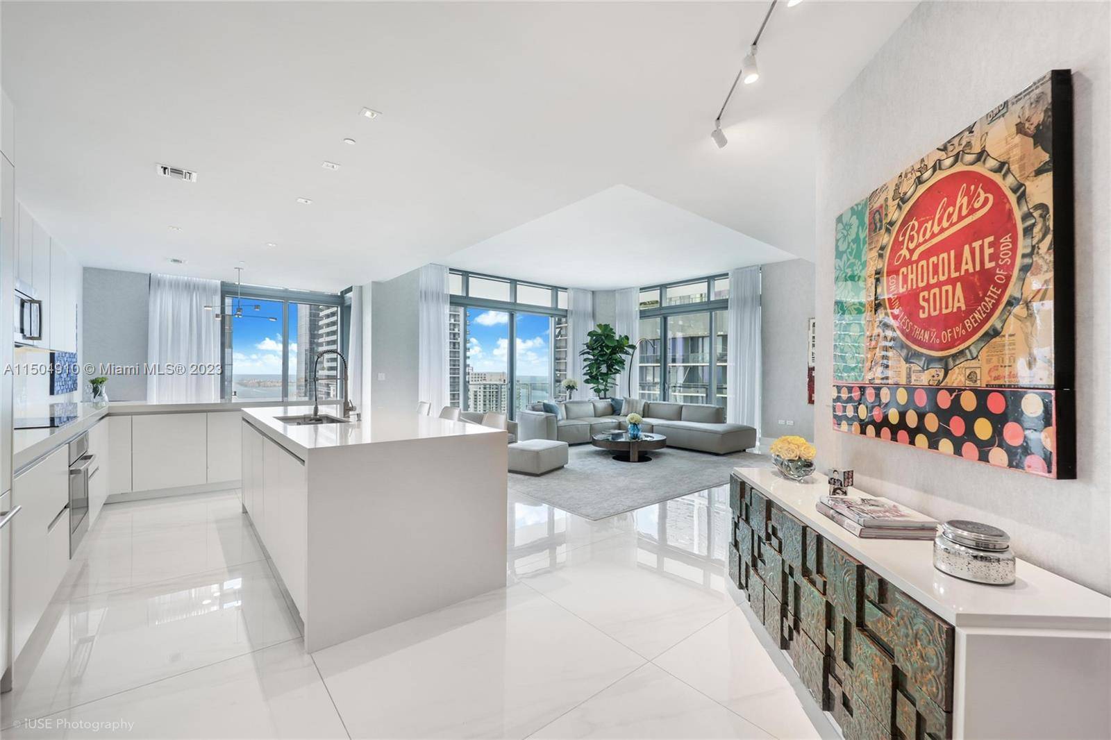 Stunning corner 4BR 4. 5BA lower penthouse unit offering breathtaking panoramic water and skyline views from sunrise to sunset in the elegant Rise building adjacent to Brickell City Center Mall.