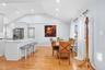Dining space with light wood finished floors, vaulted ceiling, plenty of natural light, and recessed lighting