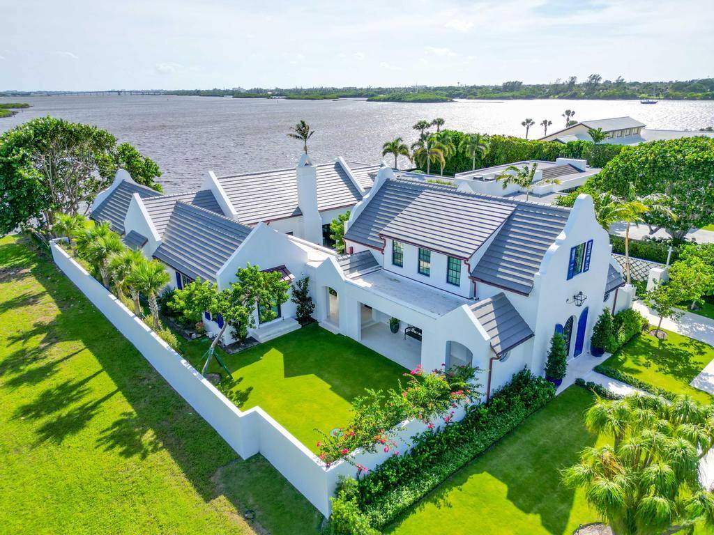 This newly constructed 2023 Dutch Colonial residence, situated in the secluded Ibis Isle, was built by Mark Albright of Albright Construction and features broad open spaces and 100 ft of ...