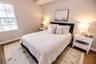 Light filled bedroom with generous storage and easy access to a full bath.
