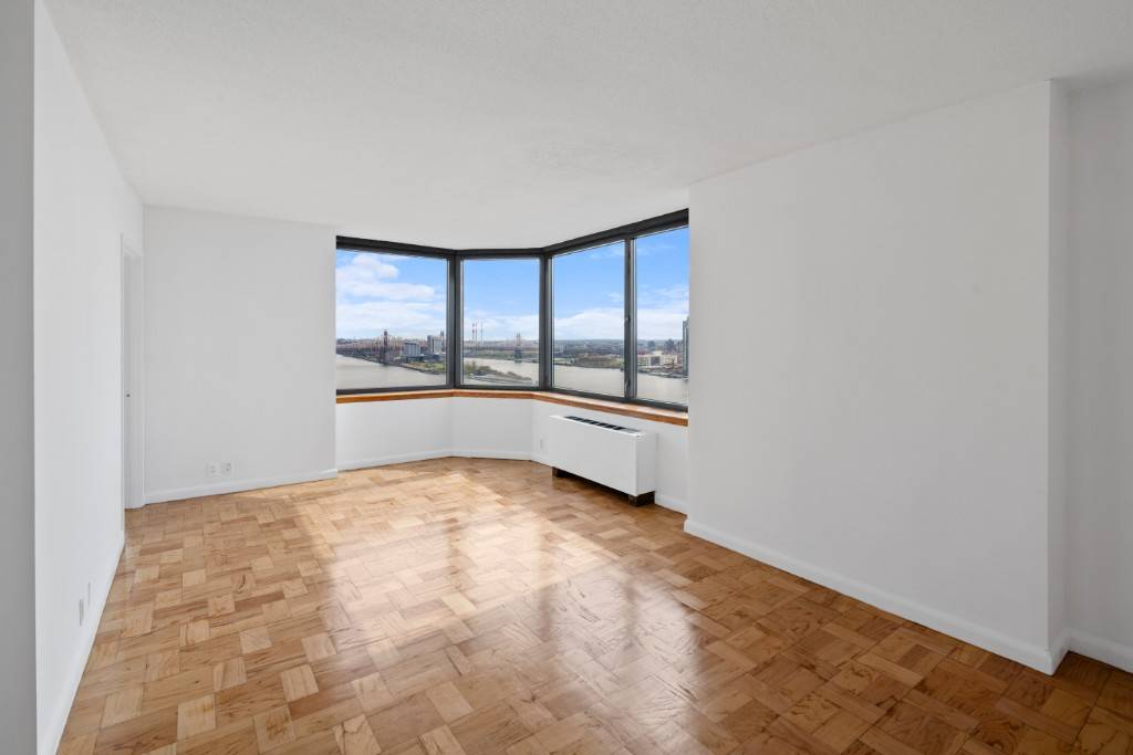 Spectacular Two Bedroom Two Baths Corner Apartment with Bay Windows and PANORAMIC East River Views You can Enjoy the Beautiful River Views and City Views in both the Living Room ...