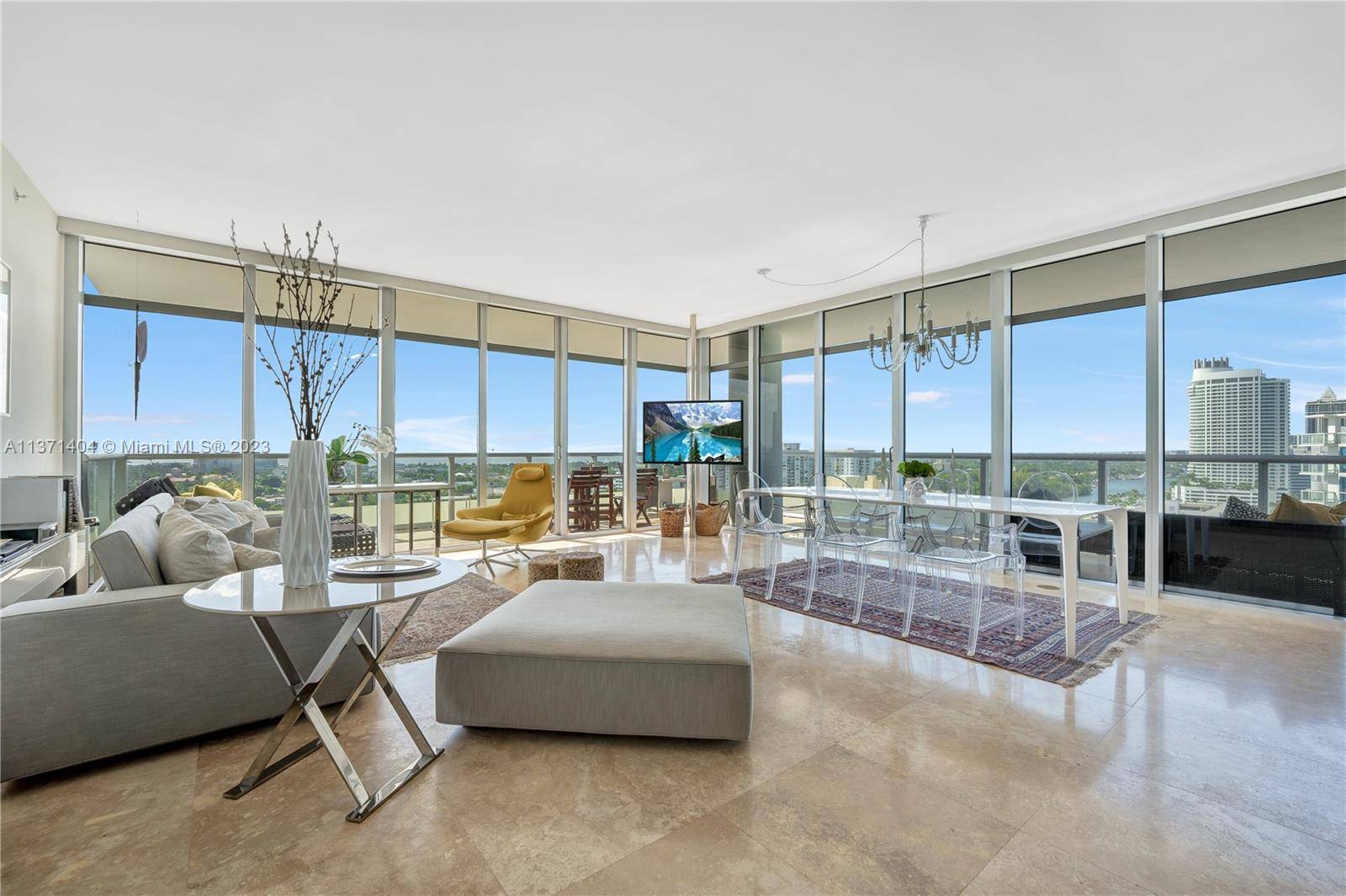 Lavish corner unit with gorgeous Intracoastal and Skyline of Miami views, High floor to ceiling impact resistant windows, Kitchen with italian cabinetry, stone countertops, marble floor, in unit washer dryer, ...