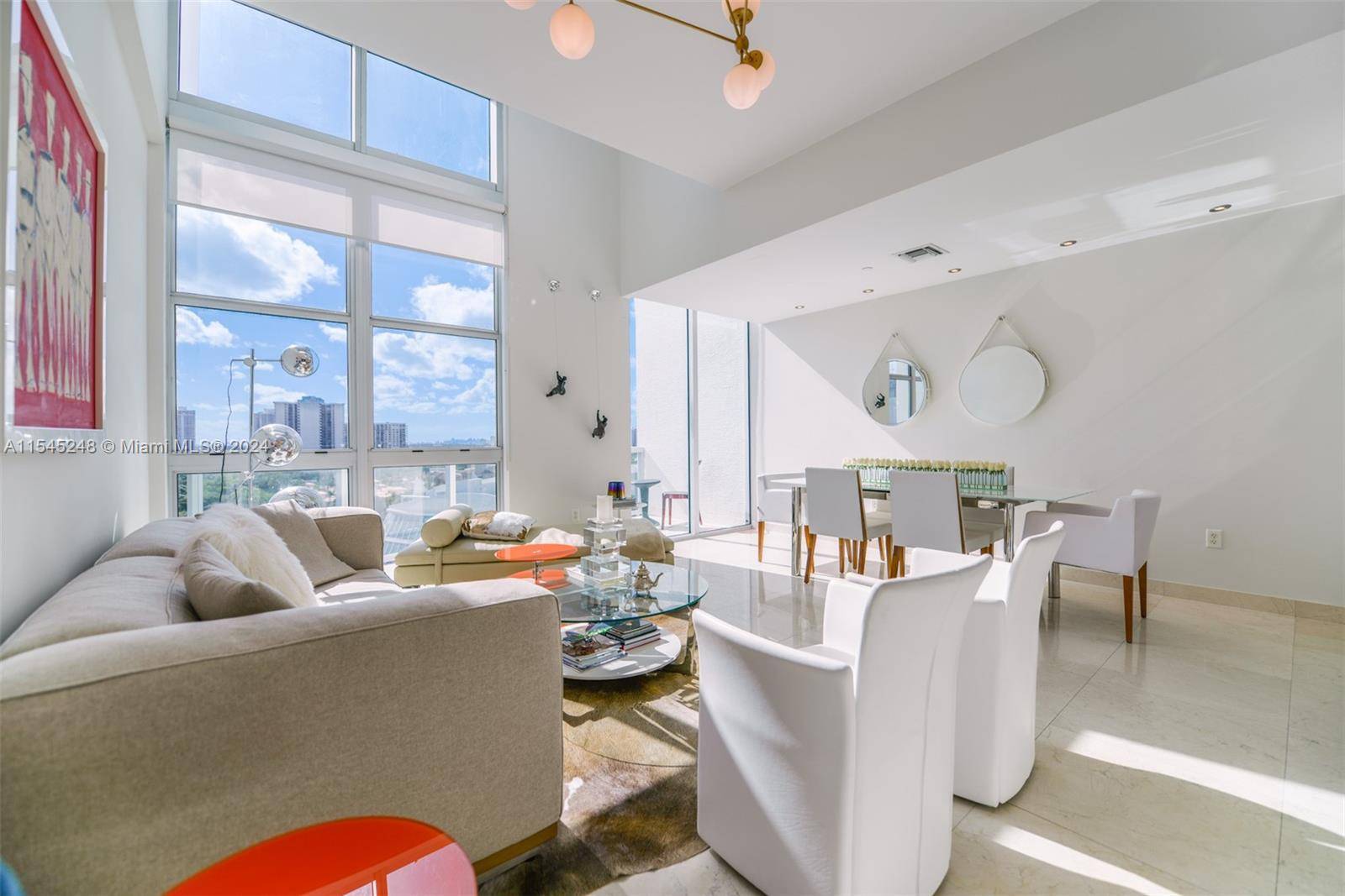 Experience luxury living in this unique two story, 2 bedroom, 2 bathroom penthouse condo boasting city and intracoastal views in Aventura, FL.