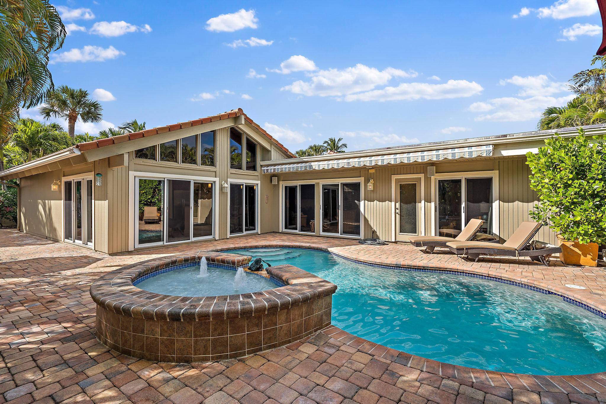 Enjoy a Summer retreat to your beach house sanctuary in gated Ocean Walk with a private oasis yard pool.