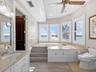 Soaking tub with water views