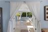 Primary Bedroom French doors to pool and patio