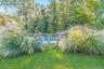 View of yard with a fenced in pool