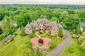 40 miles from Manhattan sits this equisite property sited high on a ridge and nestled amongst the finest estates in Connecticut.