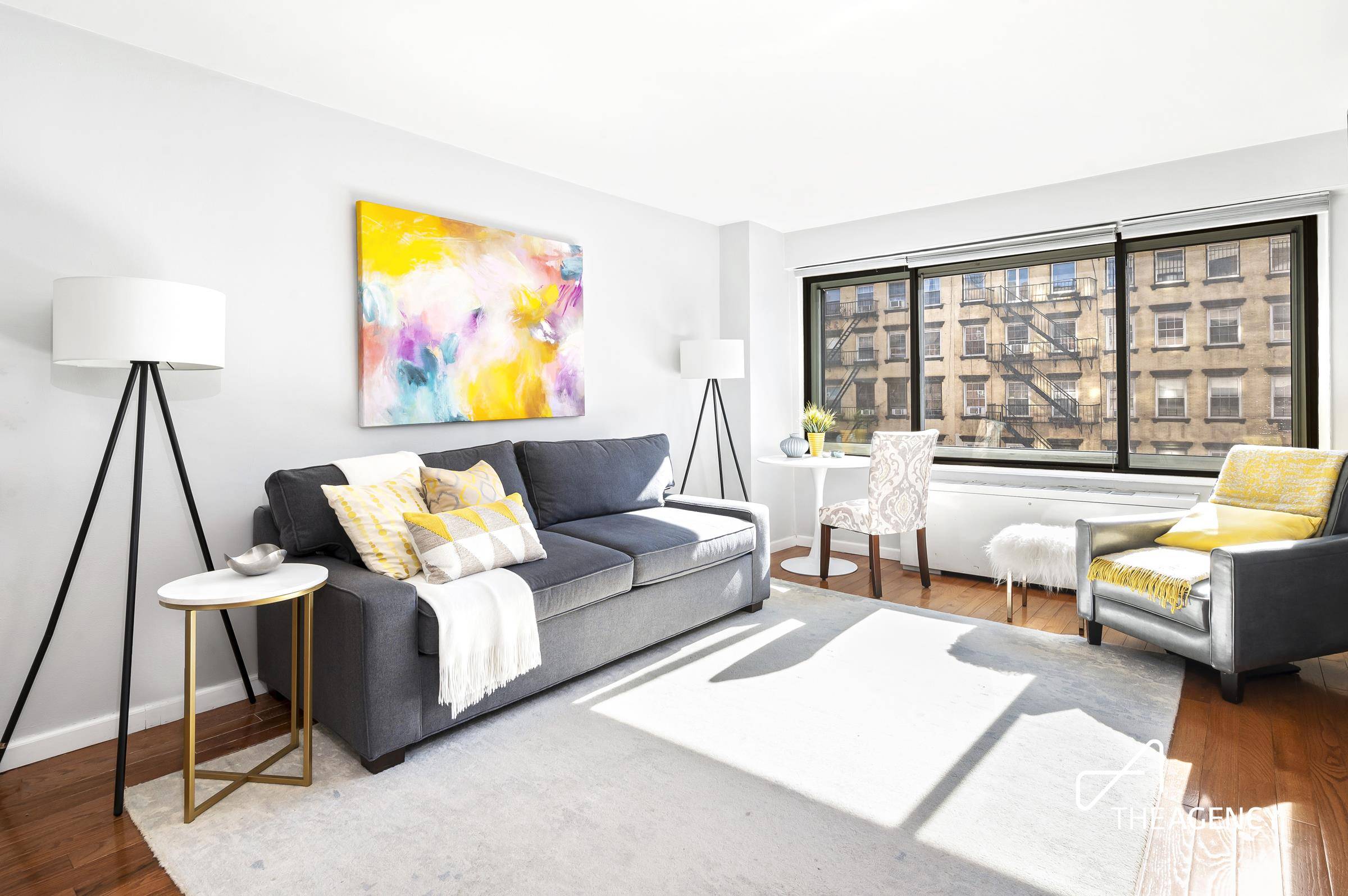 This classic midcentury co op apartment with an 11 wide wall of windows and modern upgrades is the perfect pied a terre or starter residence in central Chelsea.
