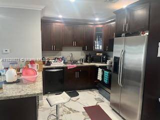 Discover refined living in this beautifully remodeled 4 bedroom, 2 bathroom home nestled in the vibrant community of Miami Gardens, FL.