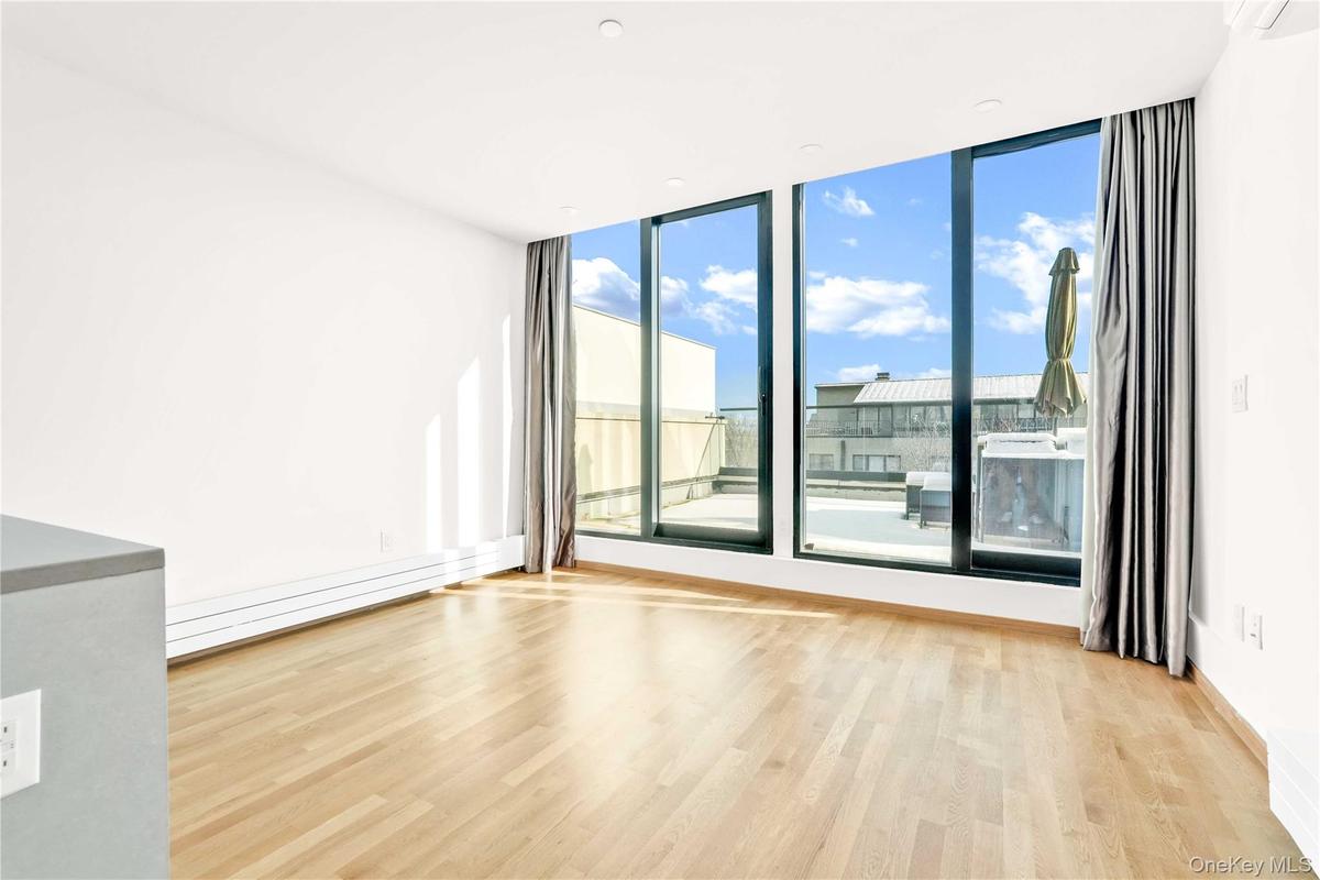 Spare room with light wood-type flooring
