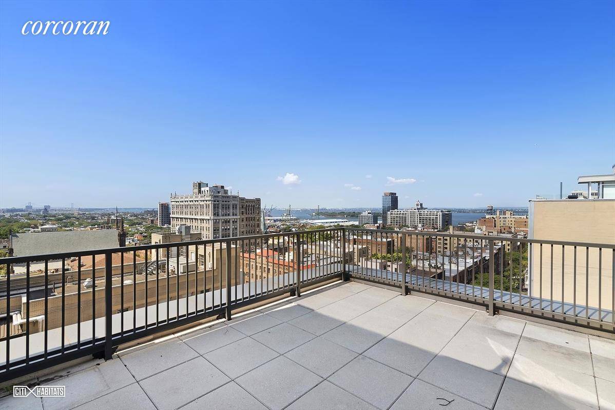 Massive three bedroom two bathroom home with spectacular city and harbor views from two private terraces.