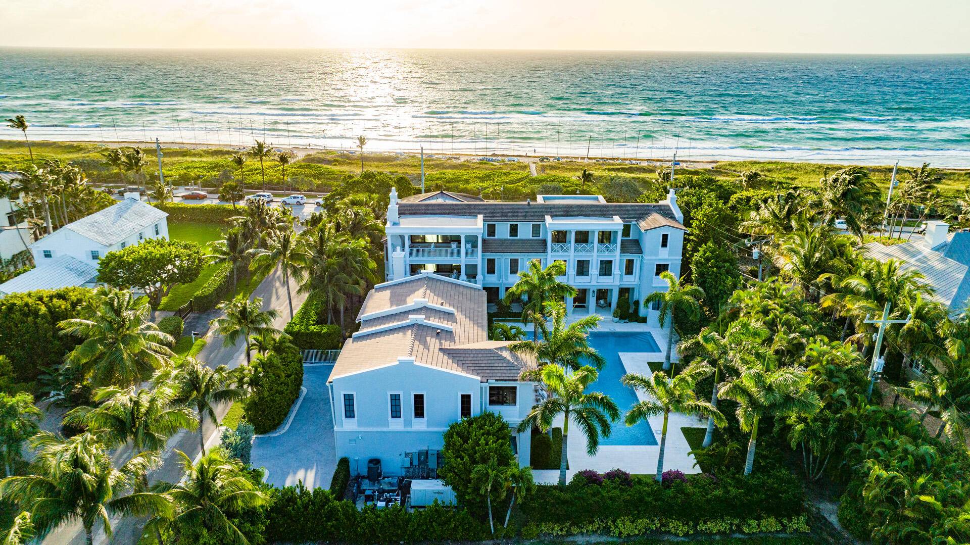 Incredible newer construction Coastal Contemporary estate features interiors that open to balconies and terraces offering ocean and pool views from almost every room.