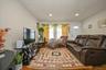 Living room featuring wood finished floors and recessed lighting