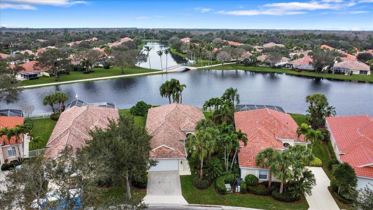 Exceptional gated Expanded Oakmont home in Riverwalk w extra long lake views on wide fenced lot.