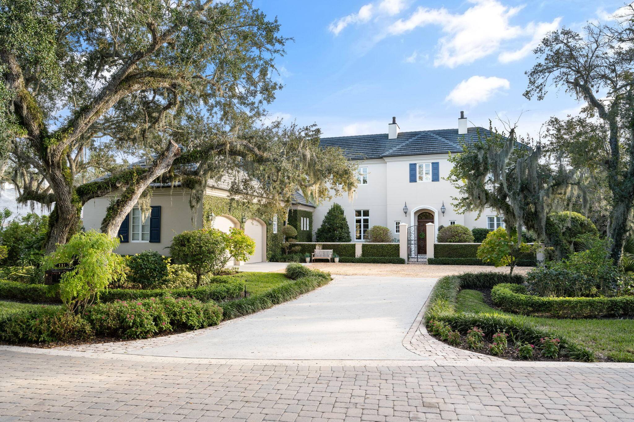 This exquisite lakeside estate epitomizes luxury living with its stunning architecture.