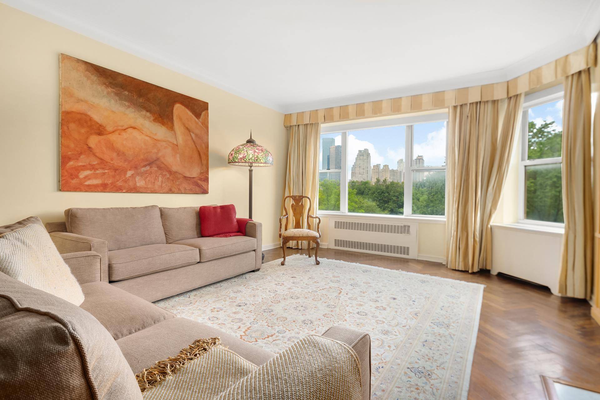 Sprawling 3 Bedroom Home Perched Above and Overlooking Fifth Avenue amp ; Central ParkThis elegant and spacious apartment opens to a charming gallery complimented by a powder room.