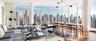 Living area with wood finished floors and a skyline view