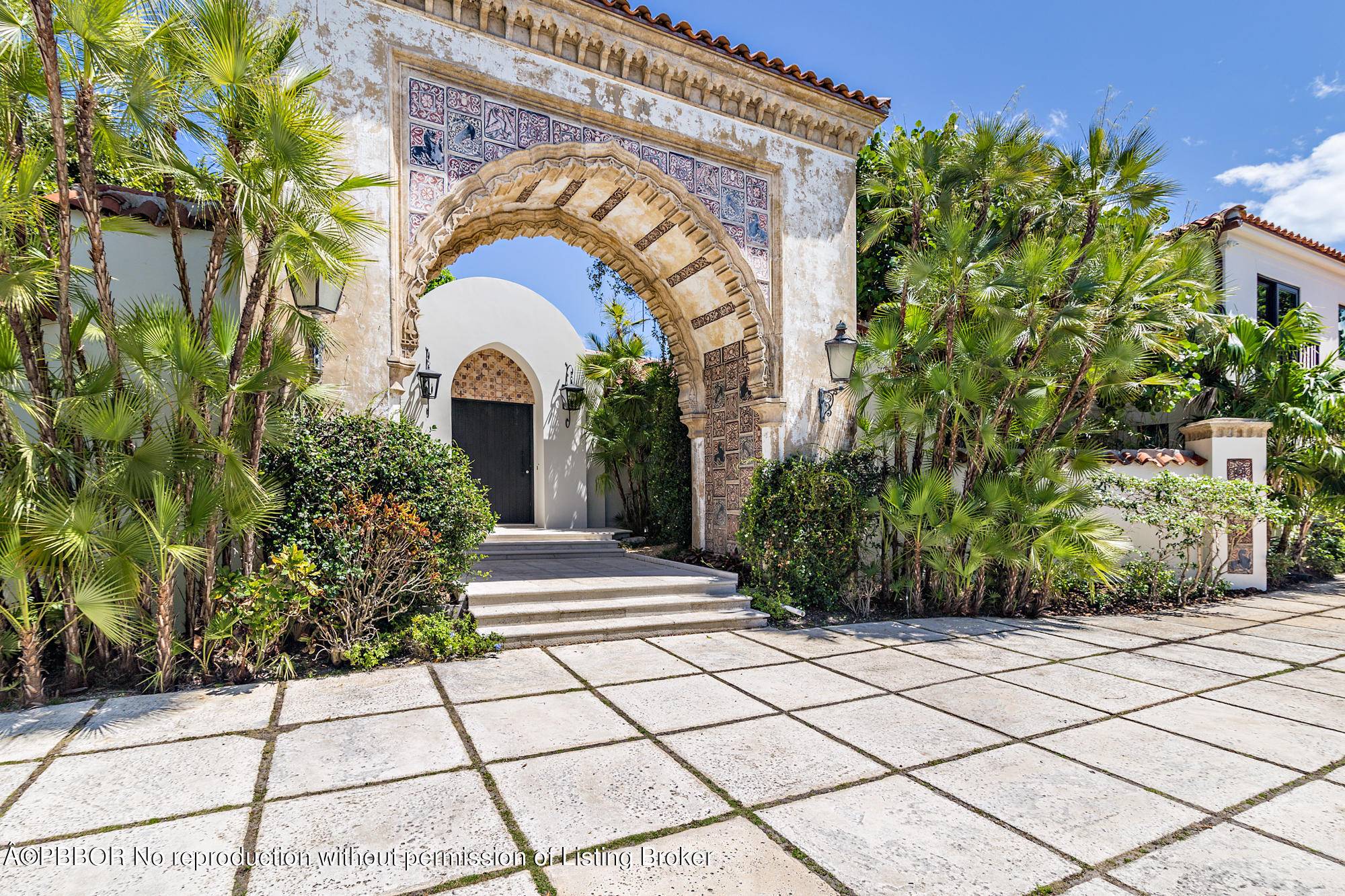 A rare offering of a significant Palm Beach property featuring the historic Fatio tiled entrance arch from the iconic Stotesbury Estate, ''El Mirasol.