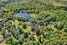 Aerial view of a large body of water and a heavily wooded area