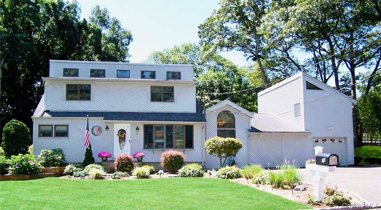 Welcome to this gorgeous Contemporary style house in Sachem SD with legal detached studio apartment.