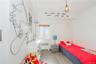 Bedroom featuring light wood-style flooring and radiator