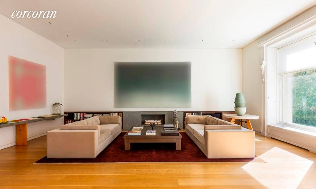 This dramatic three bedroom duplex condominium is just steps from Central Park off Fifth Avenue.